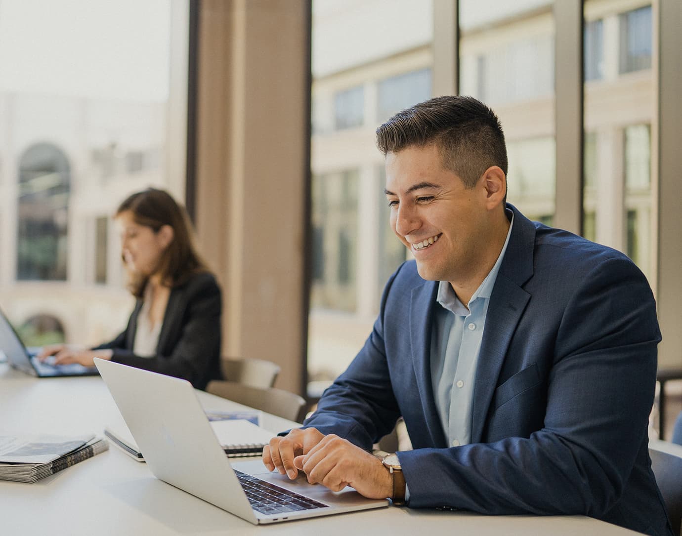 A professional explores MBA programs on his laptop A professional explores MBA programs on his laptop